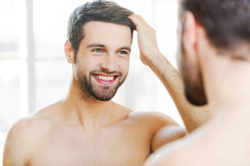 Starting,New,Day,With,Smile.,Handsome,Young,Man,Touching,His